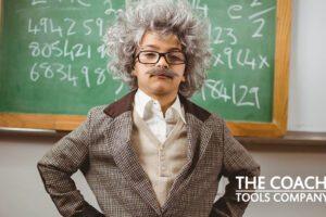 Little Einstein in front of blackboard with Coaching Questions to Get Unstuck